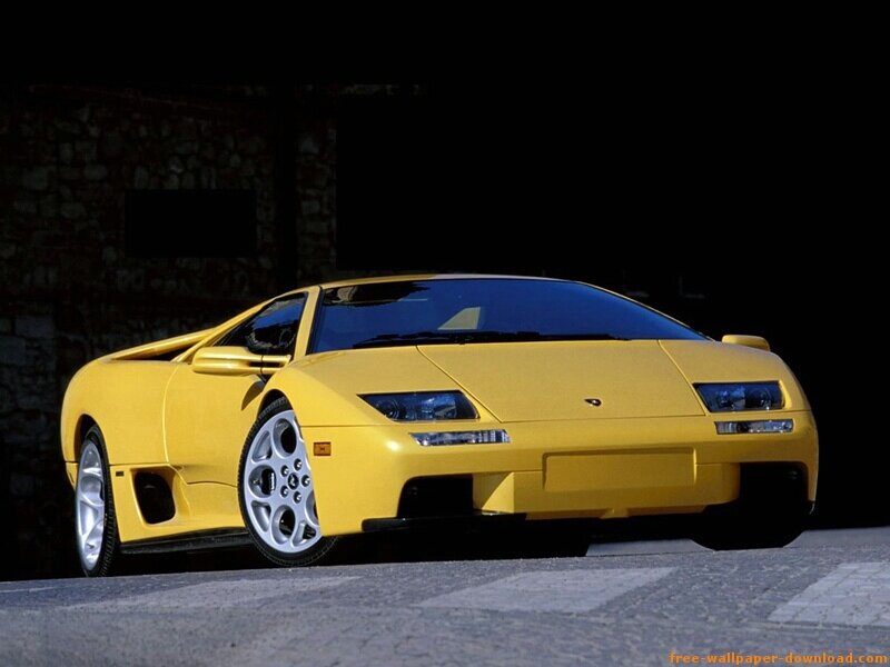 Yellow Sports Car — Dramatic, Photograph, Stone Wall