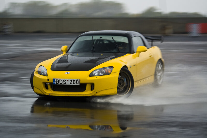 yellow sports car drifting