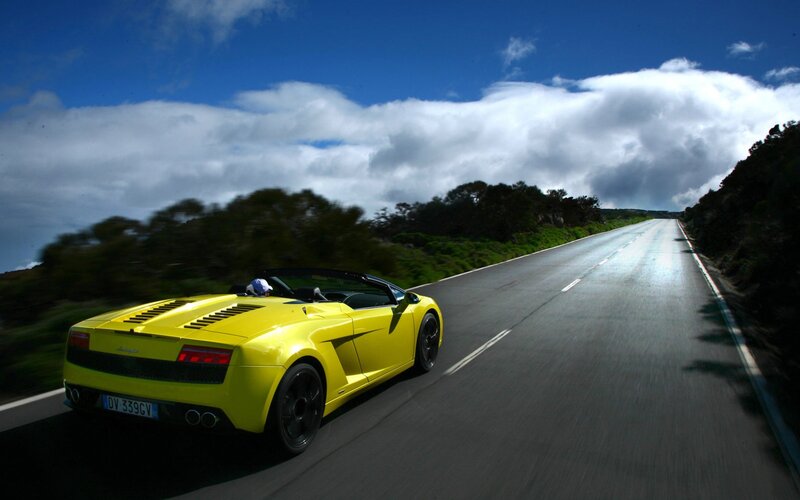 Yellow Sports Car — Dynamic, Afternoon, Photograph, Road, Trees, Sky, Blue
