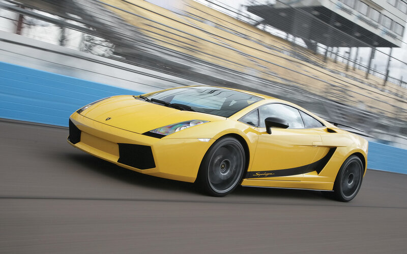 Yellow Sports Car — Dynamic, Photograph, Race Track, Blue Wall