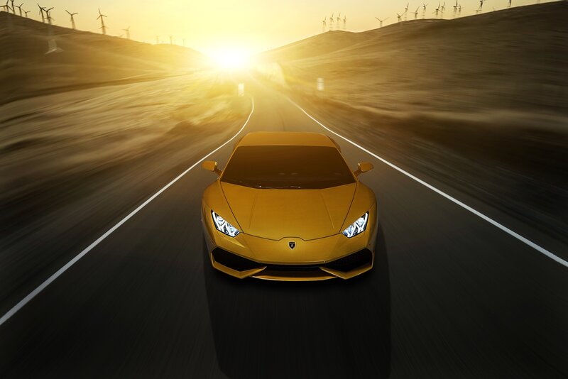 Yellow Sports Car — Dynamic, Sunset, Photograph, Wind Turbines