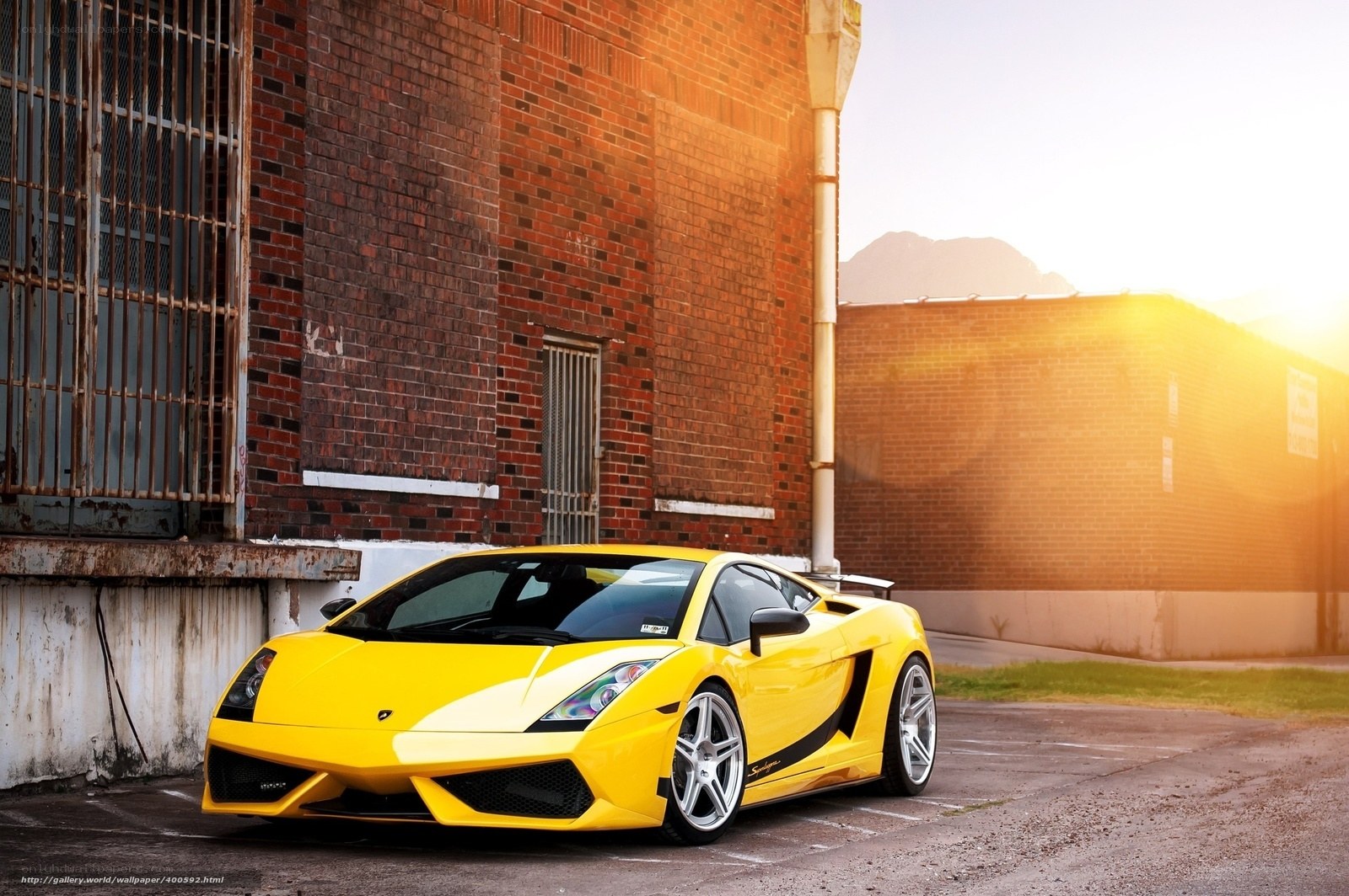 Yellow sports car in alley