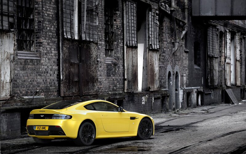 Yellow sports car in alley