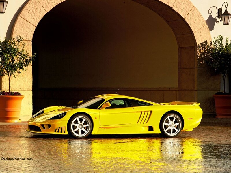 yellow sports car in archway