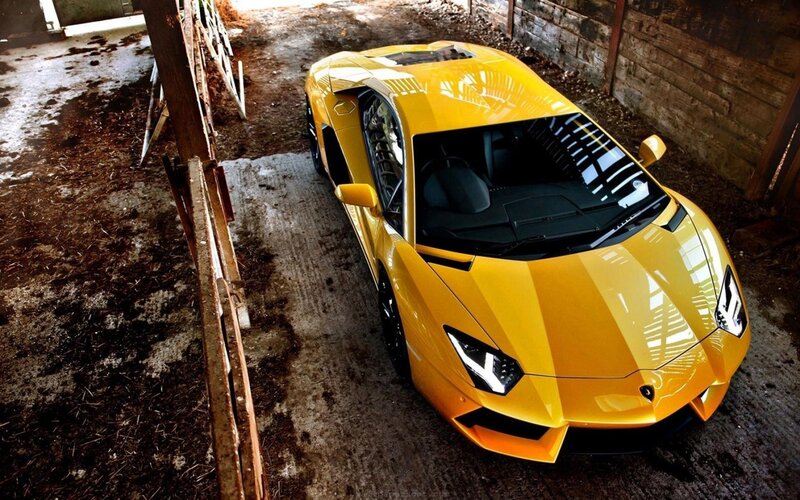 Yellow sports car in barn