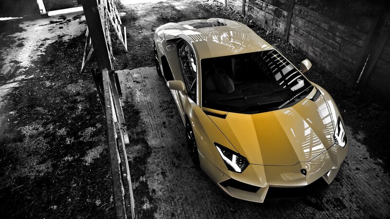 yellow sports car in barn