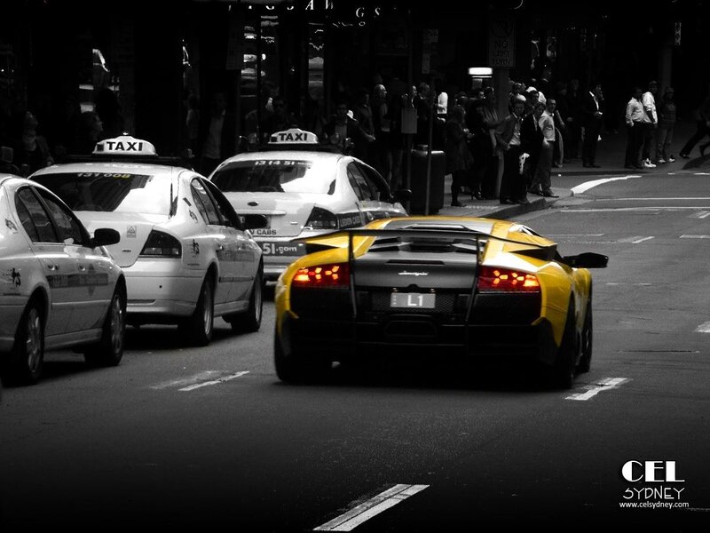 Yellow sports car in city traffic