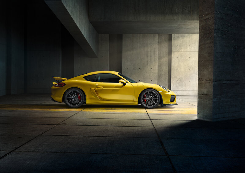 Yellow sports car in concrete garage