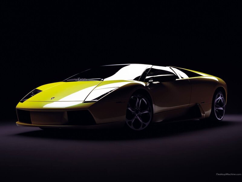 yellow sports car in dark studio