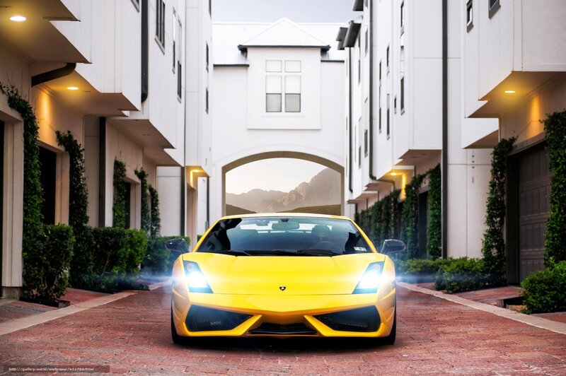 Yellow sports car in driveway