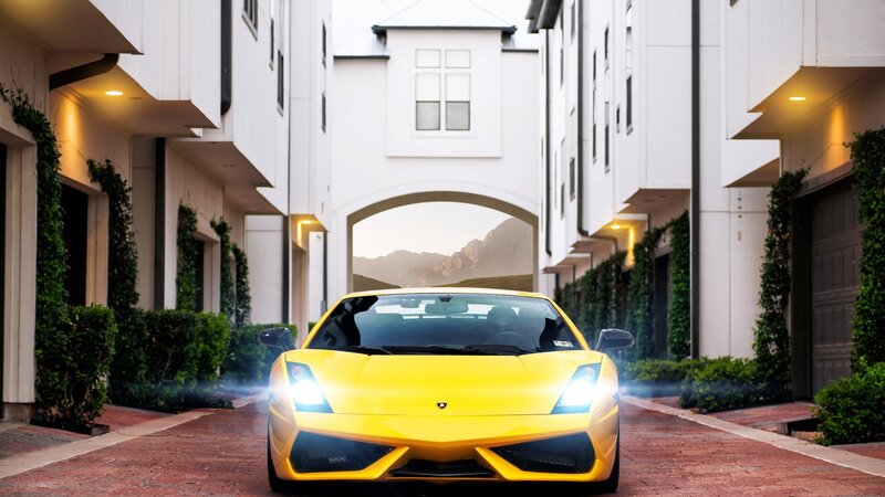 Yellow sports car in driveway