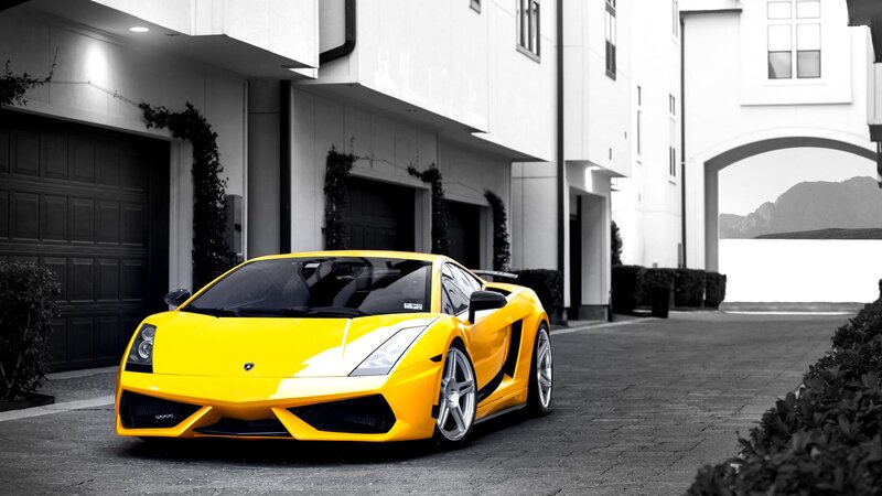 Yellow sports car in driveway
