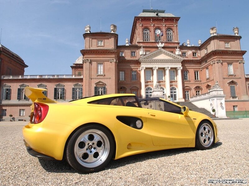 Yellow sports car in front of palace