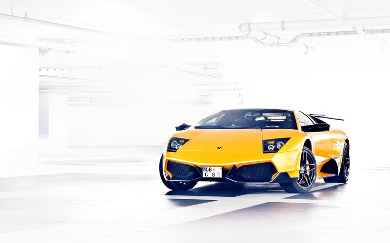 yellow sports car in garage