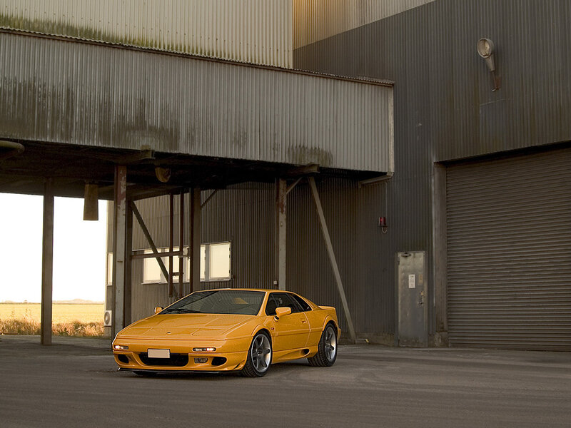 Yellow sports car in industrial setting