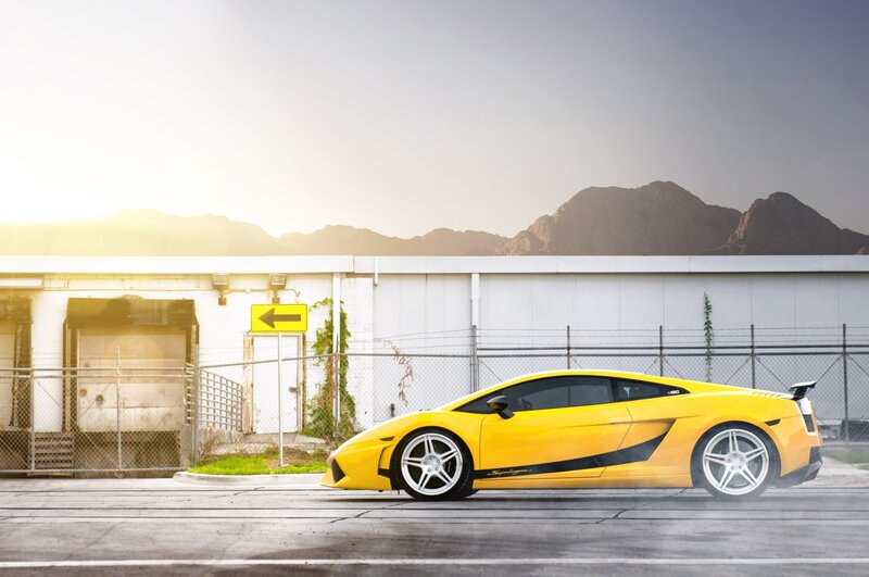 Yellow sports car in industrial setting