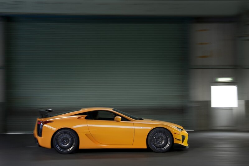 Yellow sports car in motion
