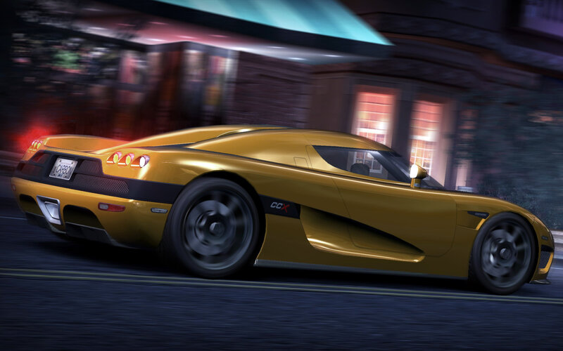 yellow sports car in motion