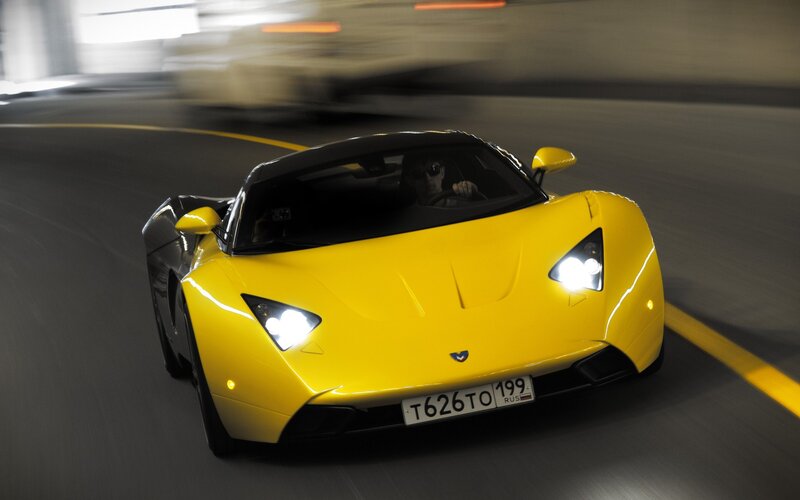 Yellow sports car in motion