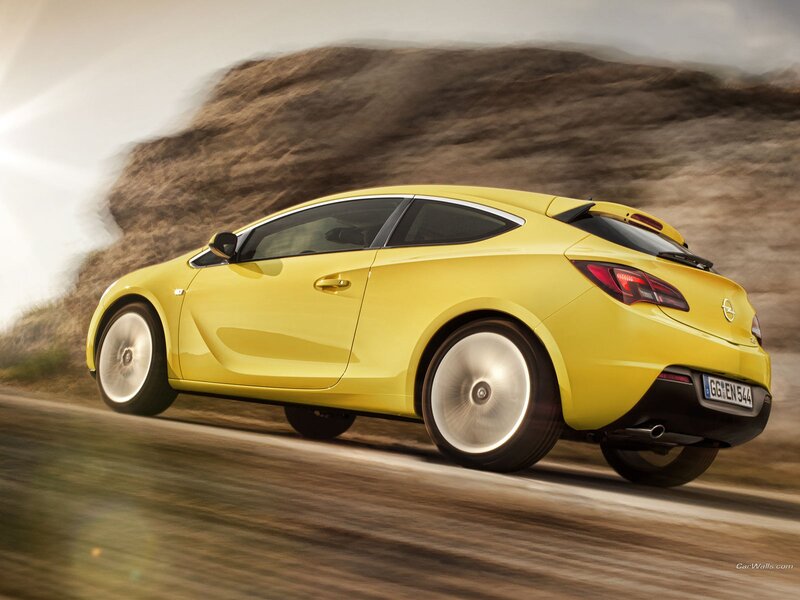 yellow sports car in motion