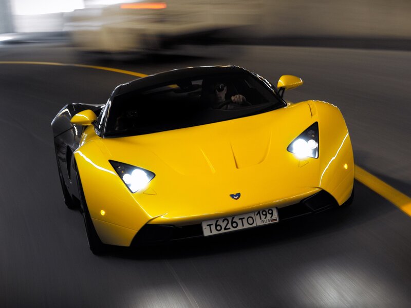 Yellow sports car in motion