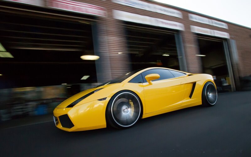 Yellow sports car in motion