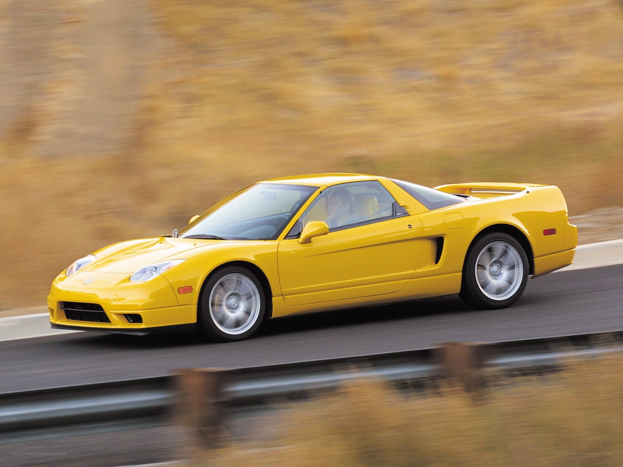 Yellow sports car in motion