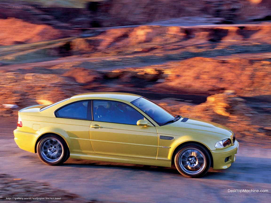yellow sports car in motion