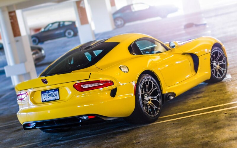 Yellow sports car in parking garage