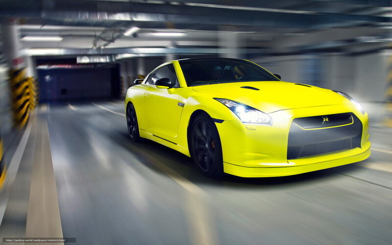 yellow sports car in parking garage