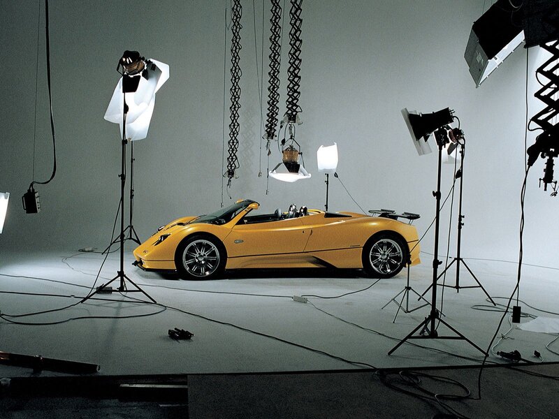 Yellow sports car in photo studio