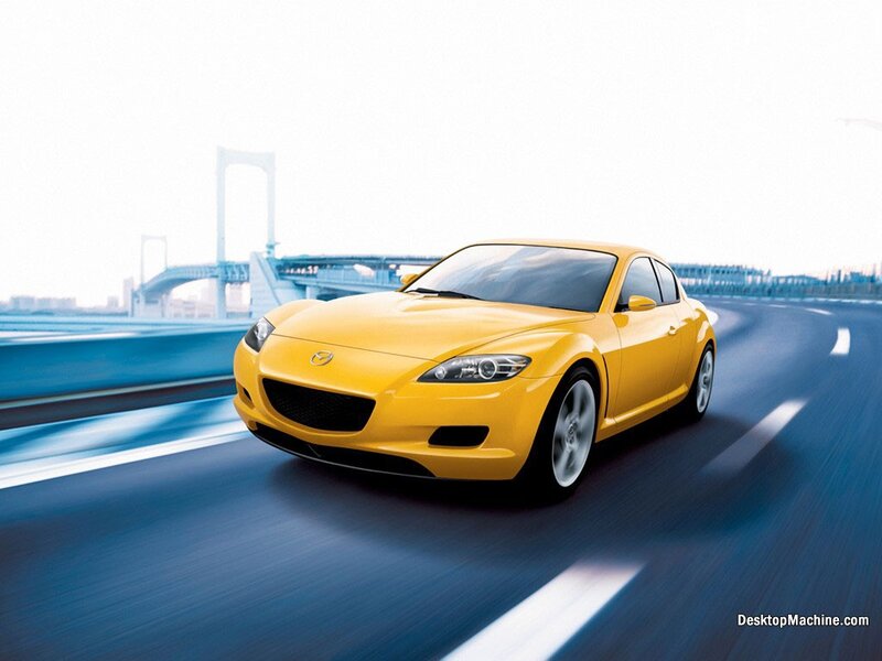 yellow sports car on a bridge