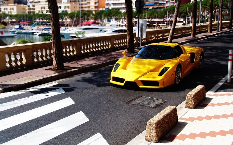 Yellow sports car on a city street