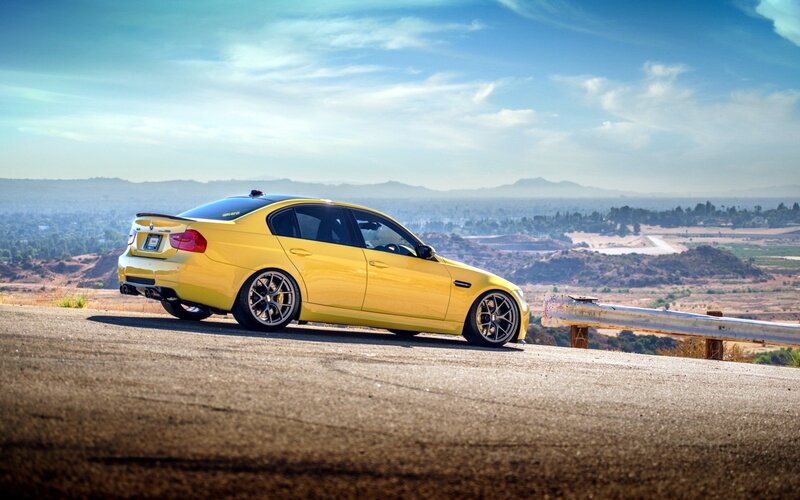 yellow sports car on a hill