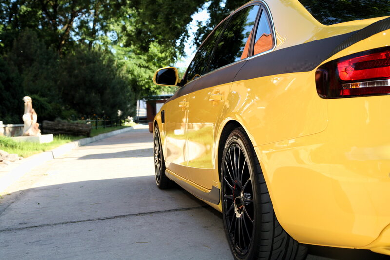 yellow sports car on a path