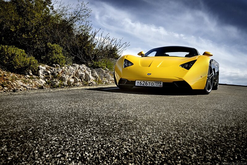 Yellow sports car on a road