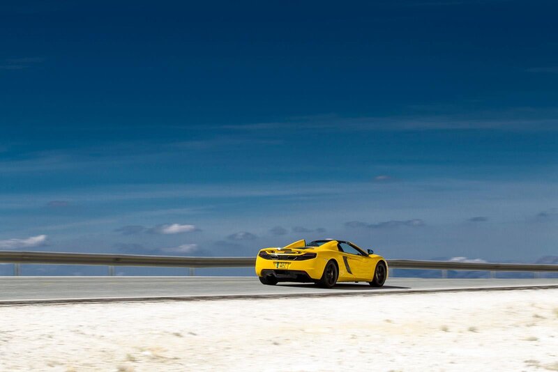 Yellow sports car on a road