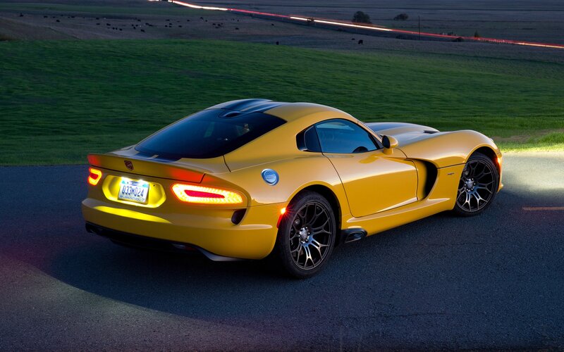 Yellow sports car on a road