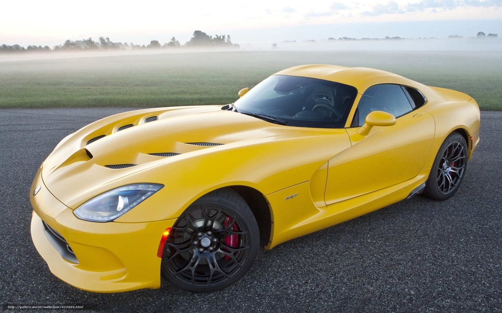 Yellow sports car on a road