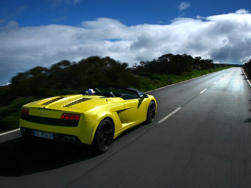 Yellow sports car on a road