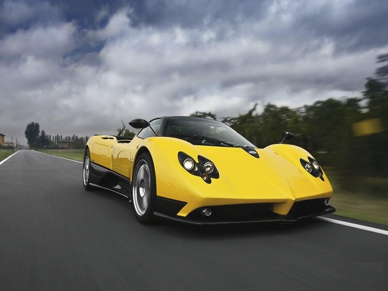 Yellow sports car on a road