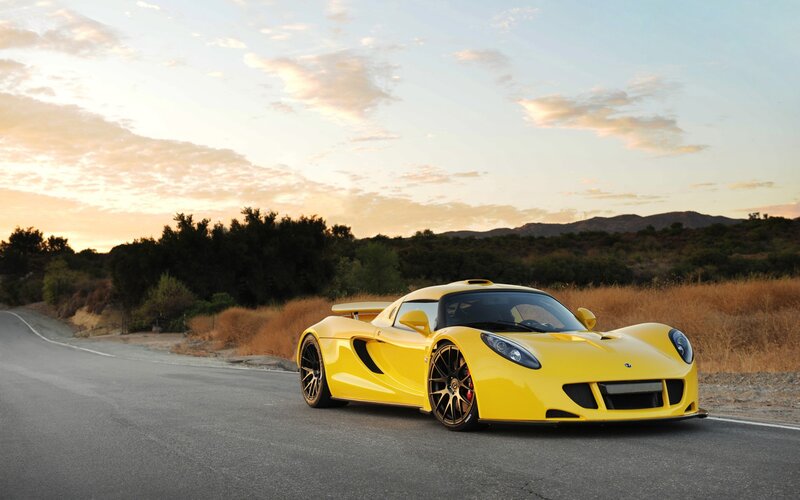 Yellow sports car on a road