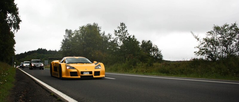 Yellow sports car on a road