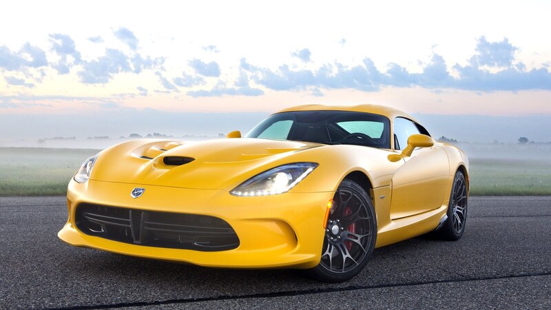 Yellow sports car on a road