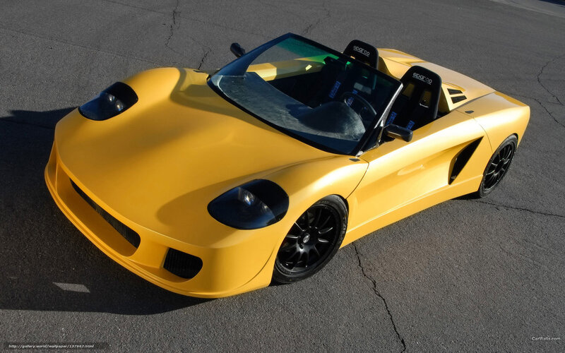 yellow sports car on asphalt