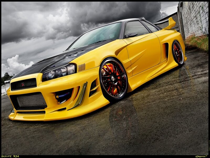 yellow sports car on asphalt