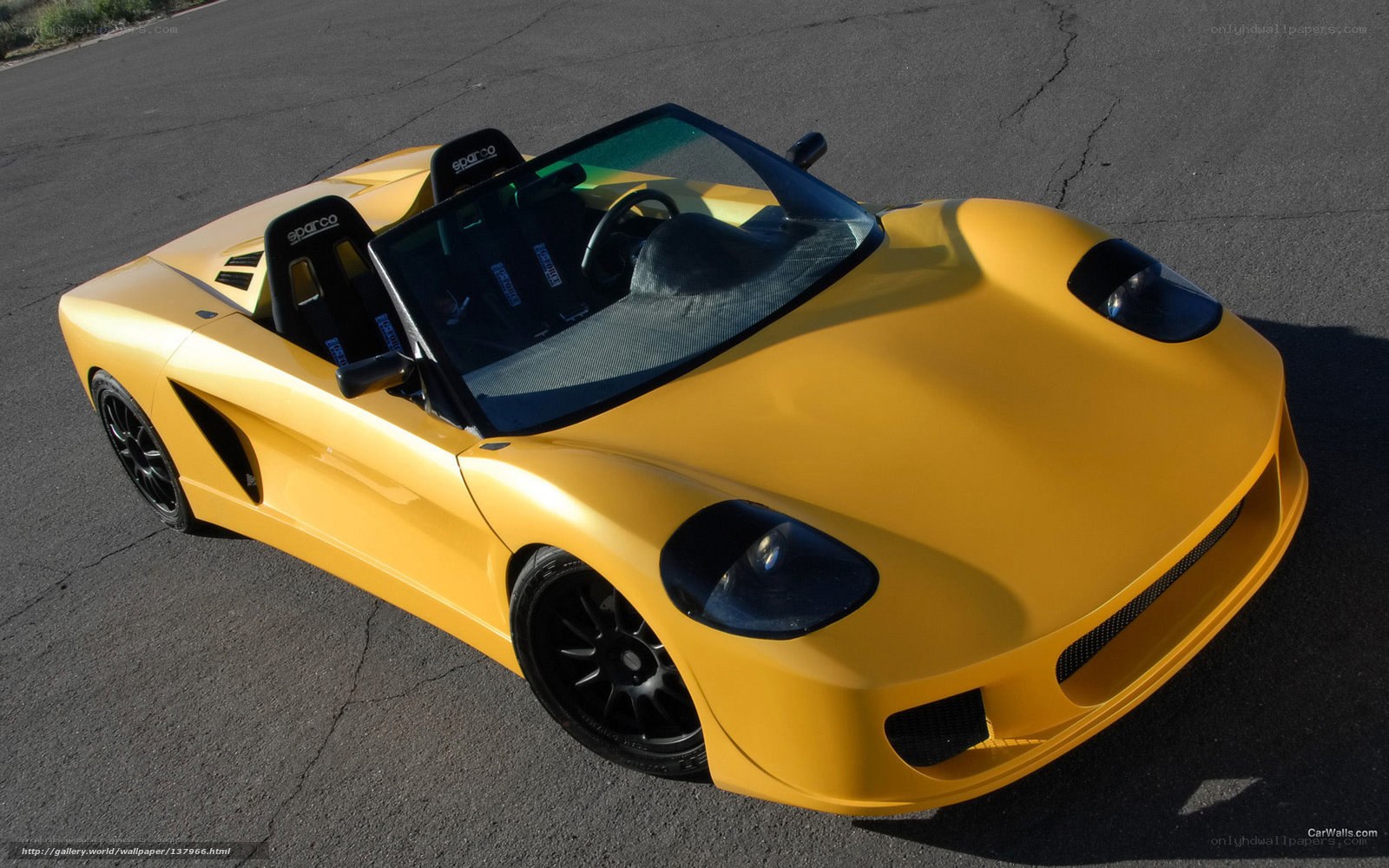 yellow sports car on asphalt