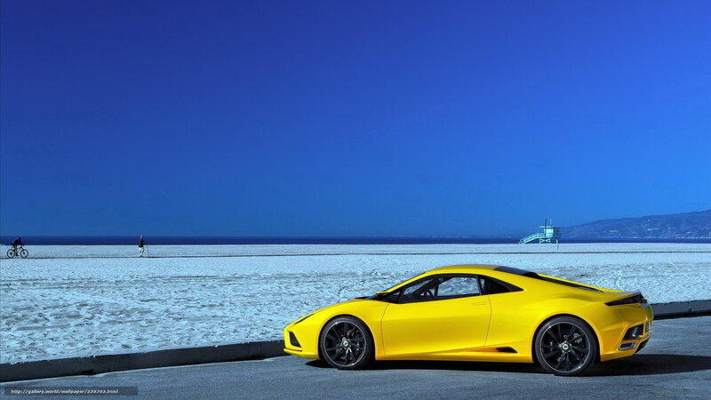 Yellow sports car on beach