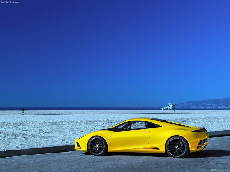 Yellow sports car on beach