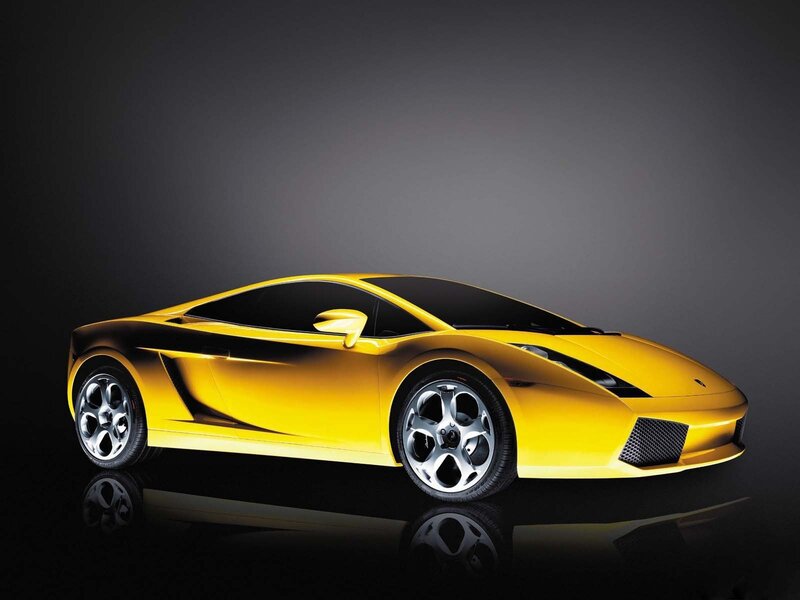 yellow sports car on black